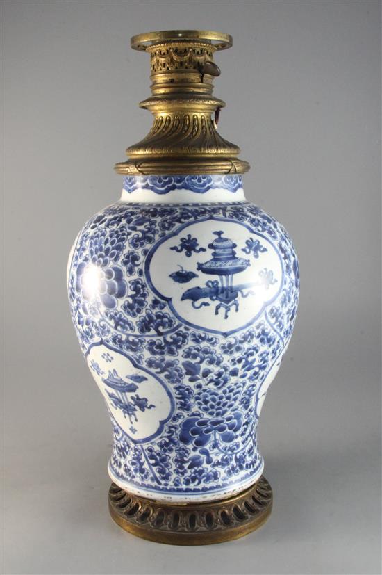 A Chinese blue and white antiques and lotus vase, Qing dynasty, Kangxi period, height 13.75in.